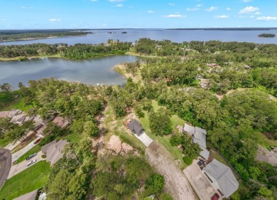 Experience unparalleled lakeside living at 147 Brushwood Ct on Rayburn Country Club in Texas - for sale on GolfHomes.com, golf home, golf lot