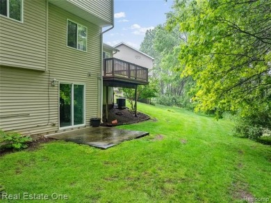 Move-in ready colonial tucked at the end of a peaceful on Whispering Pines Golf  in Michigan - for sale on GolfHomes.com, golf home, golf lot