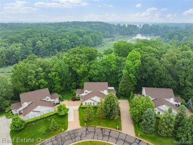 Move-in ready colonial tucked at the end of a peaceful on Whispering Pines Golf  in Michigan - for sale on GolfHomes.com, golf home, golf lot