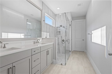 This sophisticated lakefront residence in The Falls at Grand on Oak Harbor Country Club in Florida - for sale on GolfHomes.com, golf home, golf lot