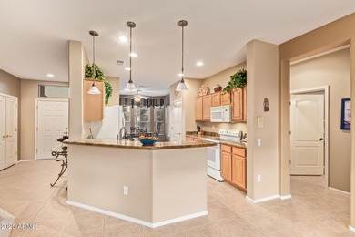 Welcome to effortless living in Sun City Grand! This beautifully on Sun City Grand Golf Couse and Club in Arizona - for sale on GolfHomes.com, golf home, golf lot