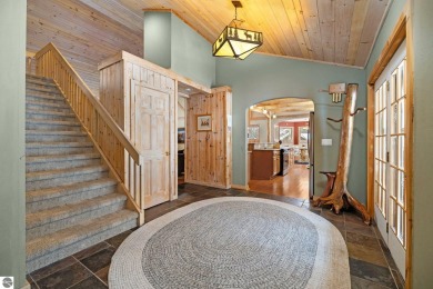 Cedar River Village at its finest! Log & stone dcor gives this on Cedar River Golf Course in Michigan - for sale on GolfHomes.com, golf home, golf lot