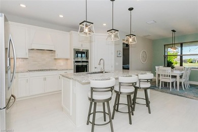 ZERO-CORNER SLIDERS - POND VIEW - 2.5-CAR GARAGE - TILE on Panther Run Golf Club in Florida - for sale on GolfHomes.com, golf home, golf lot