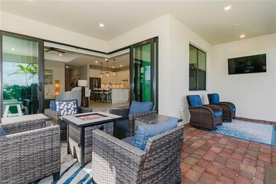 ZERO-CORNER SLIDERS - POND VIEW - 2.5-CAR GARAGE - TILE on Panther Run Golf Club in Florida - for sale on GolfHomes.com, golf home, golf lot