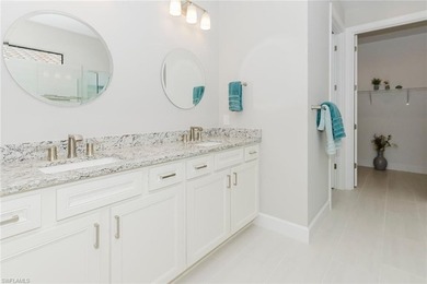 ZERO-CORNER SLIDERS - POND VIEW - 2.5-CAR GARAGE - TILE on Panther Run Golf Club in Florida - for sale on GolfHomes.com, golf home, golf lot