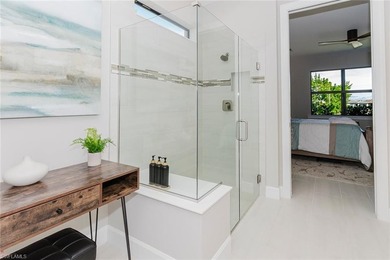 ZERO-CORNER SLIDERS - POND VIEW - 2.5-CAR GARAGE - TILE on Panther Run Golf Club in Florida - for sale on GolfHomes.com, golf home, golf lot