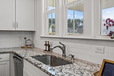 Set on a peaceful pond homesite in the Lochton subsection of on Cypress Point Par 3 in South Carolina - for sale on GolfHomes.com, golf home, golf lot