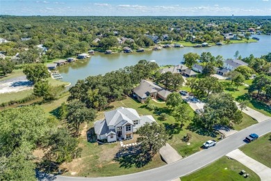 Nestled majestically on the coveted shores of private and secure on Lake Kiowa Golf Course in Texas - for sale on GolfHomes.com, golf home, golf lot