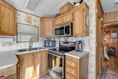 Experience the charm of relaxed Florida living in this lovingly on Del Tura Golf and Country Club in Florida - for sale on GolfHomes.com, golf home, golf lot