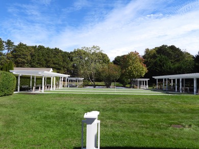 On the 6th hole at Southport, this turn-key ''Vineyard'' on The Golf Club At Southport in Massachusetts - for sale on GolfHomes.com, golf home, golf lot