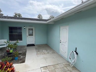 What a view! Come see this 1 bed, 1.5 bath home located on lake on Summertree Golf Course in Florida - for sale on GolfHomes.com, golf home, golf lot