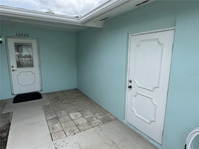 What a view! Come see this 1 bed, 1.5 bath home located on lake on Summertree Golf Course in Florida - for sale on GolfHomes.com, golf home, golf lot
