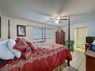 Nestled alongside the tranquil 14th hole of the golf course on Beacon Woods Golf Club in Florida - for sale on GolfHomes.com, golf home, golf lot