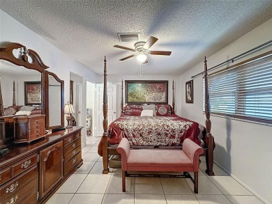 Nestled alongside the tranquil 14th hole of the golf course on Beacon Woods Golf Club in Florida - for sale on GolfHomes.com, golf home, golf lot
