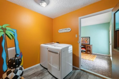 VIBRANT INKS LAKE COTTAGE -- Set on 1.2+ acres across two on Highland Lakes Golf Club in Texas - for sale on GolfHomes.com, golf home, golf lot