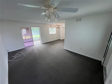 What a view! Come see this 1 bed, 1.5 bath home located on lake on Summertree Golf Course in Florida - for sale on GolfHomes.com, golf home, golf lot