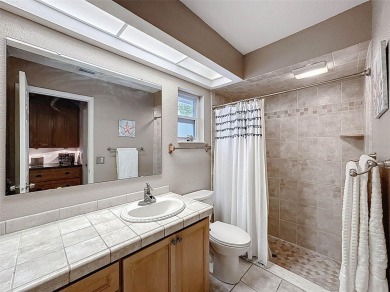 Nestled alongside the tranquil 14th hole of the golf course on Beacon Woods Golf Club in Florida - for sale on GolfHomes.com, golf home, golf lot