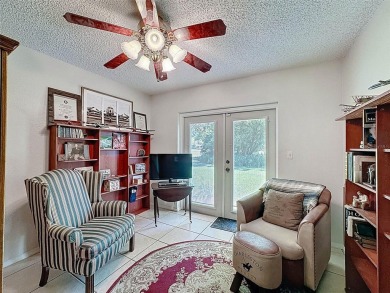 Nestled alongside the tranquil 14th hole of the golf course on Beacon Woods Golf Club in Florida - for sale on GolfHomes.com, golf home, golf lot