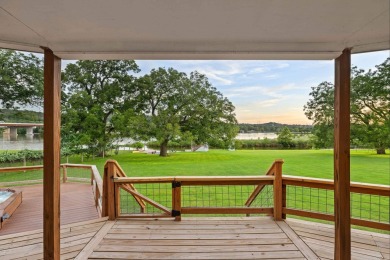 VIBRANT INKS LAKE COTTAGE -- Set on 1.2+ acres across two on Highland Lakes Golf Club in Texas - for sale on GolfHomes.com, golf home, golf lot