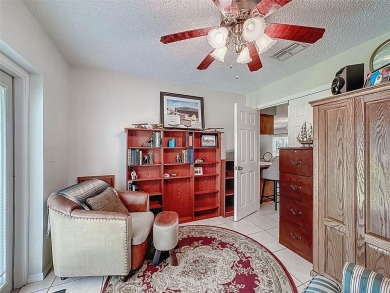 Nestled alongside the tranquil 14th hole of the golf course on Beacon Woods Golf Club in Florida - for sale on GolfHomes.com, golf home, golf lot