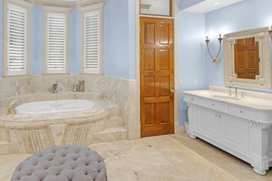 Luxurious Lakefront Living on Burnt Pine's Hole 6. This 4BR/4BA on Sandestin Golf and Beach Resort - Raven in Florida - for sale on GolfHomes.com, golf home, golf lot