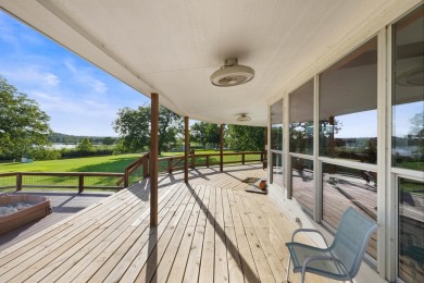 VIBRANT INKS LAKE COTTAGE -- Set on 1.2+ acres across two on Highland Lakes Golf Club in Texas - for sale on GolfHomes.com, golf home, golf lot