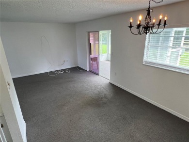What a view! Come see this 1 bed, 1.5 bath home located on lake on Summertree Golf Course in Florida - for sale on GolfHomes.com, golf home, golf lot