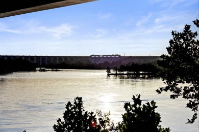 VIBRANT INKS LAKE COTTAGE -- Set on 1.2+ acres across two on Highland Lakes Golf Club in Texas - for sale on GolfHomes.com, golf home, golf lot