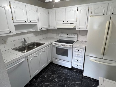 What a view! Come see this 1 bed, 1.5 bath home located on lake on Summertree Golf Course in Florida - for sale on GolfHomes.com, golf home, golf lot
