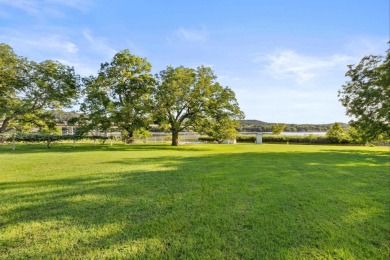 VIBRANT INKS LAKE COTTAGE -- Set on 1.2+ acres across two on Highland Lakes Golf Club in Texas - for sale on GolfHomes.com, golf home, golf lot