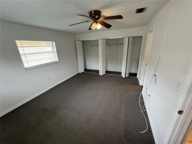 What a view! Come see this 1 bed, 1.5 bath home located on lake on Summertree Golf Course in Florida - for sale on GolfHomes.com, golf home, golf lot