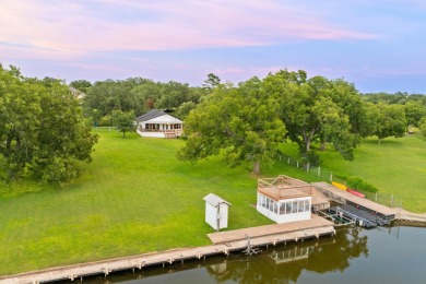 VIBRANT INKS LAKE COTTAGE -- Set on 1.2+ acres across two on Highland Lakes Golf Club in Texas - for sale on GolfHomes.com, golf home, golf lot