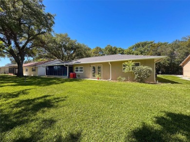 Nestled alongside the tranquil 14th hole of the golf course on Beacon Woods Golf Club in Florida - for sale on GolfHomes.com, golf home, golf lot