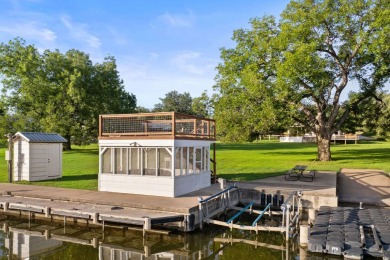 VIBRANT INKS LAKE COTTAGE -- Set on 1.2+ acres across two on Highland Lakes Golf Club in Texas - for sale on GolfHomes.com, golf home, golf lot