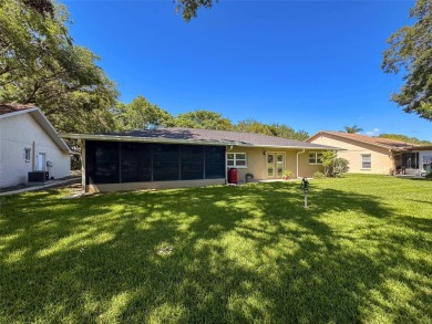Nestled alongside the tranquil 14th hole of the golf course on Beacon Woods Golf Club in Florida - for sale on GolfHomes.com, golf home, golf lot