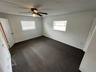 What a view! Come see this 1 bed, 1.5 bath home located on lake on Summertree Golf Course in Florida - for sale on GolfHomes.com, golf home, golf lot