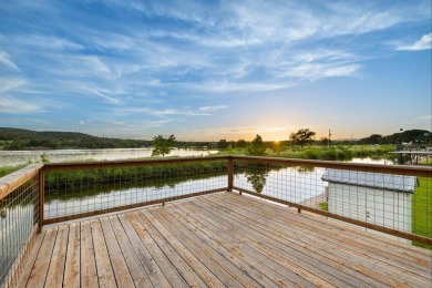 VIBRANT INKS LAKE COTTAGE -- Set on 1.2+ acres across two on Highland Lakes Golf Club in Texas - for sale on GolfHomes.com, golf home, golf lot