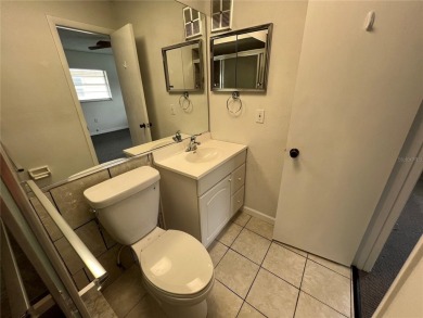 What a view! Come see this 1 bed, 1.5 bath home located on lake on Summertree Golf Course in Florida - for sale on GolfHomes.com, golf home, golf lot