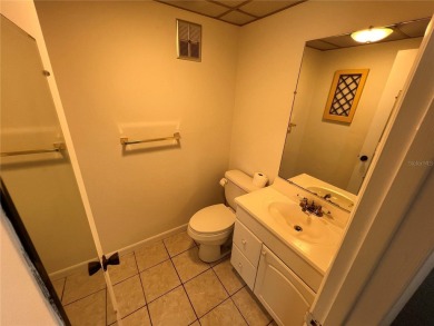What a view! Come see this 1 bed, 1.5 bath home located on lake on Summertree Golf Course in Florida - for sale on GolfHomes.com, golf home, golf lot