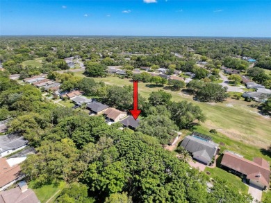 Nestled alongside the tranquil 14th hole of the golf course on Beacon Woods Golf Club in Florida - for sale on GolfHomes.com, golf home, golf lot