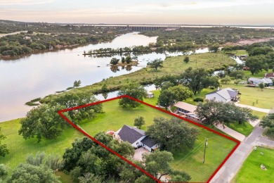 VIBRANT INKS LAKE COTTAGE -- Set on 1.2+ acres across two on Highland Lakes Golf Club in Texas - for sale on GolfHomes.com, golf home, golf lot