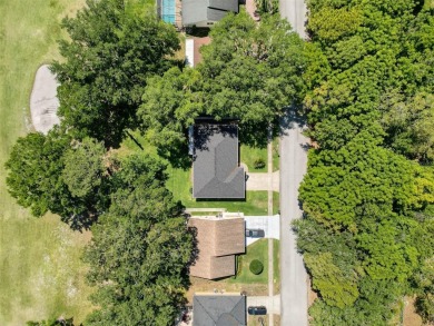 Nestled alongside the tranquil 14th hole of the golf course on Beacon Woods Golf Club in Florida - for sale on GolfHomes.com, golf home, golf lot