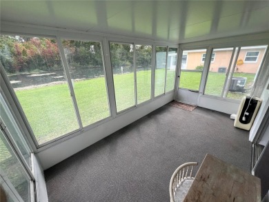 What a view! Come see this 1 bed, 1.5 bath home located on lake on Summertree Golf Course in Florida - for sale on GolfHomes.com, golf home, golf lot