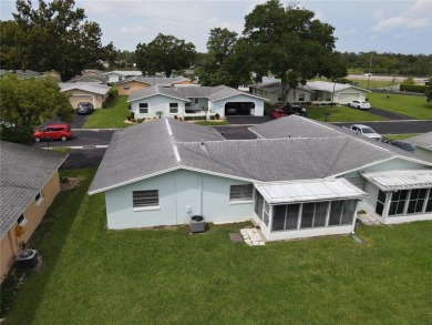 What a view! Come see this 1 bed, 1.5 bath home located on lake on Summertree Golf Course in Florida - for sale on GolfHomes.com, golf home, golf lot