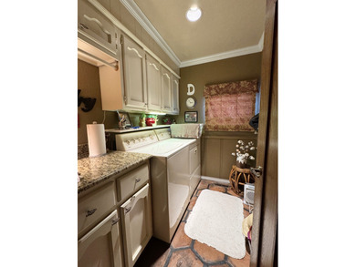 At the quiet end of a cul-de-sac in Country Club Estates, this on Idabel Country Club in Oklahoma - for sale on GolfHomes.com, golf home, golf lot