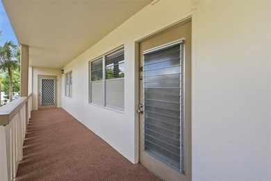 Beautifully updated second-floor condo featuring a tropical on Wynmoor Golf Course in Florida - for sale on GolfHomes.com, golf home, golf lot