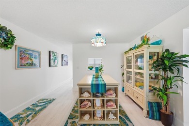 Beautifully updated second-floor condo featuring a tropical on Wynmoor Golf Course in Florida - for sale on GolfHomes.com, golf home, golf lot