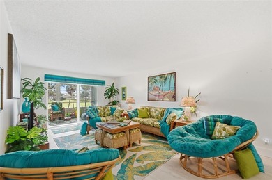 Beautifully updated second-floor condo featuring a tropical on Wynmoor Golf Course in Florida - for sale on GolfHomes.com, golf home, golf lot