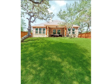 Welcome home to this Energy Star-certified residence in the on The Club At Runaway Bay in Texas - for sale on GolfHomes.com, golf home, golf lot