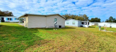 55+/1989/2 BD/2 BA/800 SQ FT/NEW FLOORING/LARGE SCREENED LANAI on Zephyrhills Municipal Golf Course in Florida - for sale on GolfHomes.com, golf home, golf lot